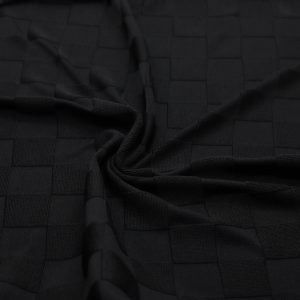 Plain black jacquard knit with textured small checks
