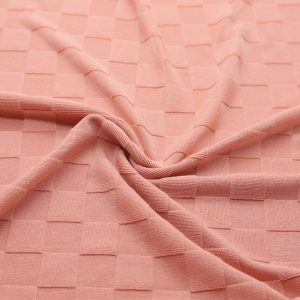 Plain salmon jacquard knit with small check texture