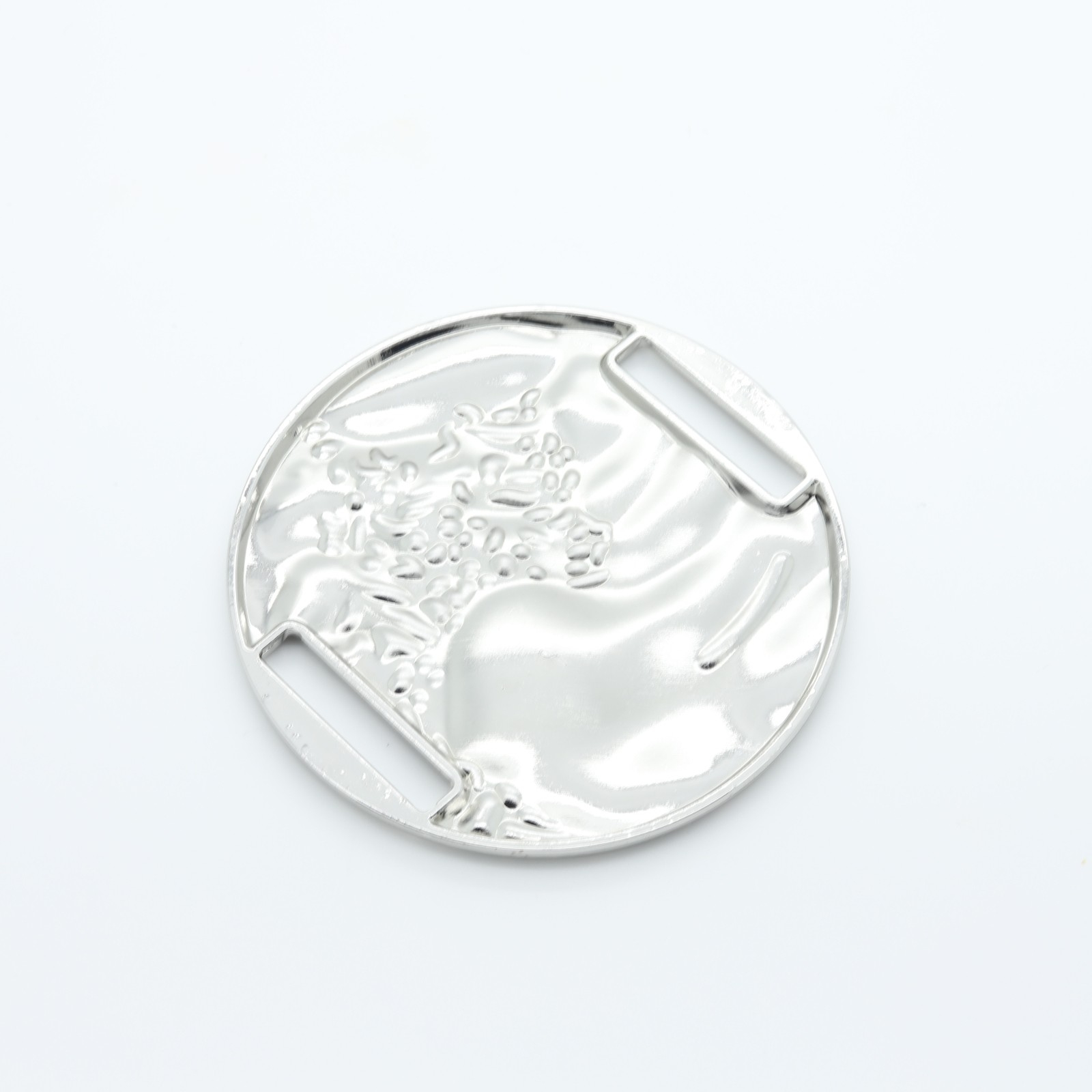 Large round silver-plated loop with relief structure