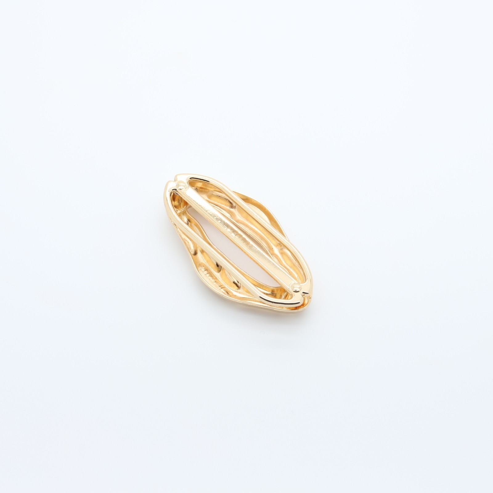 Small oval-shaped loop in gilded metal