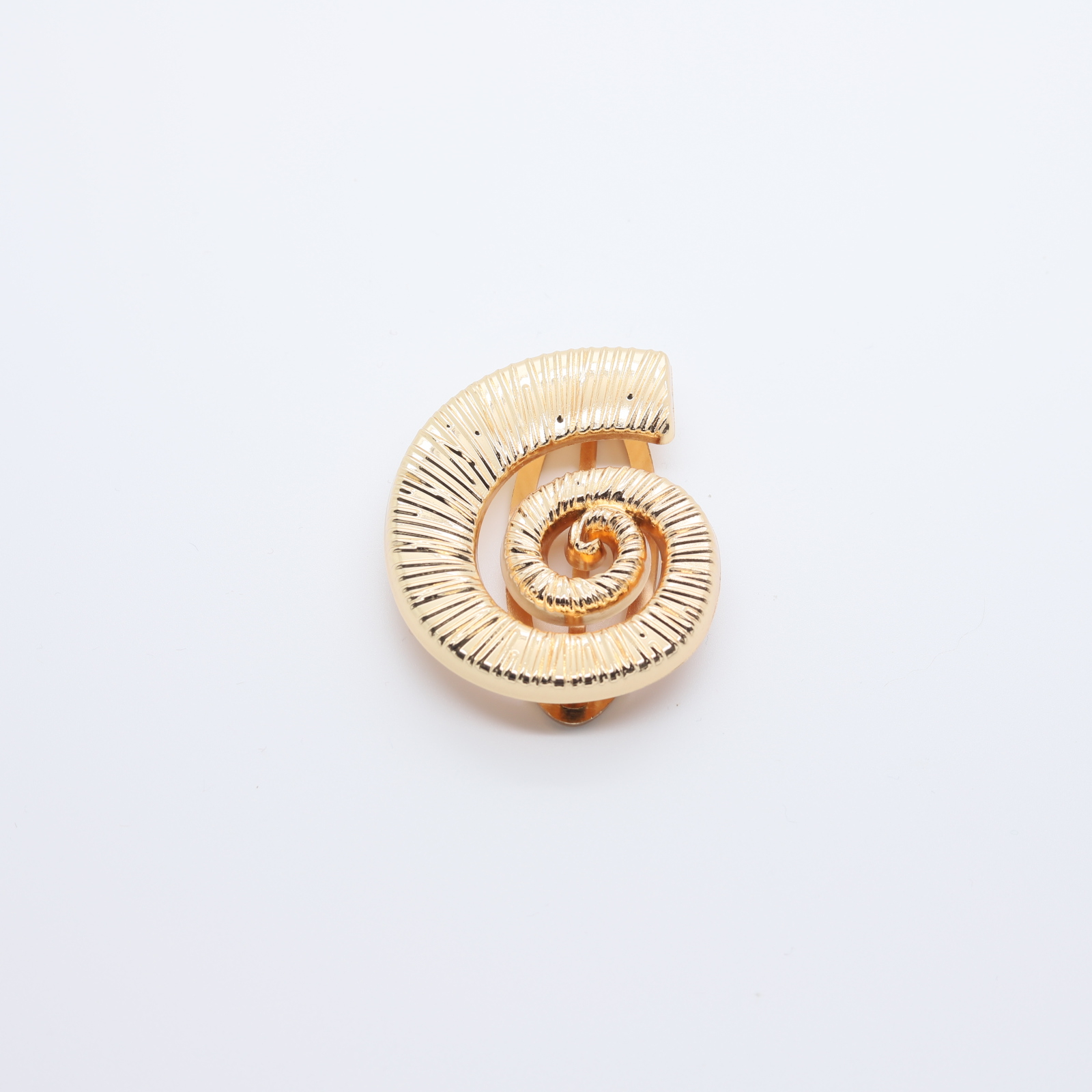 Passant en forme de coquille de conque
