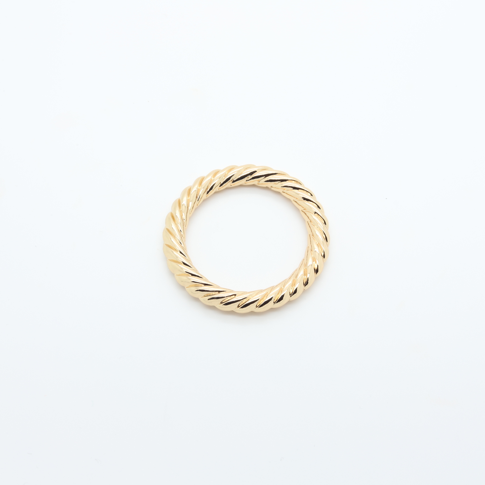 Twisted gold-plated metal connector ring