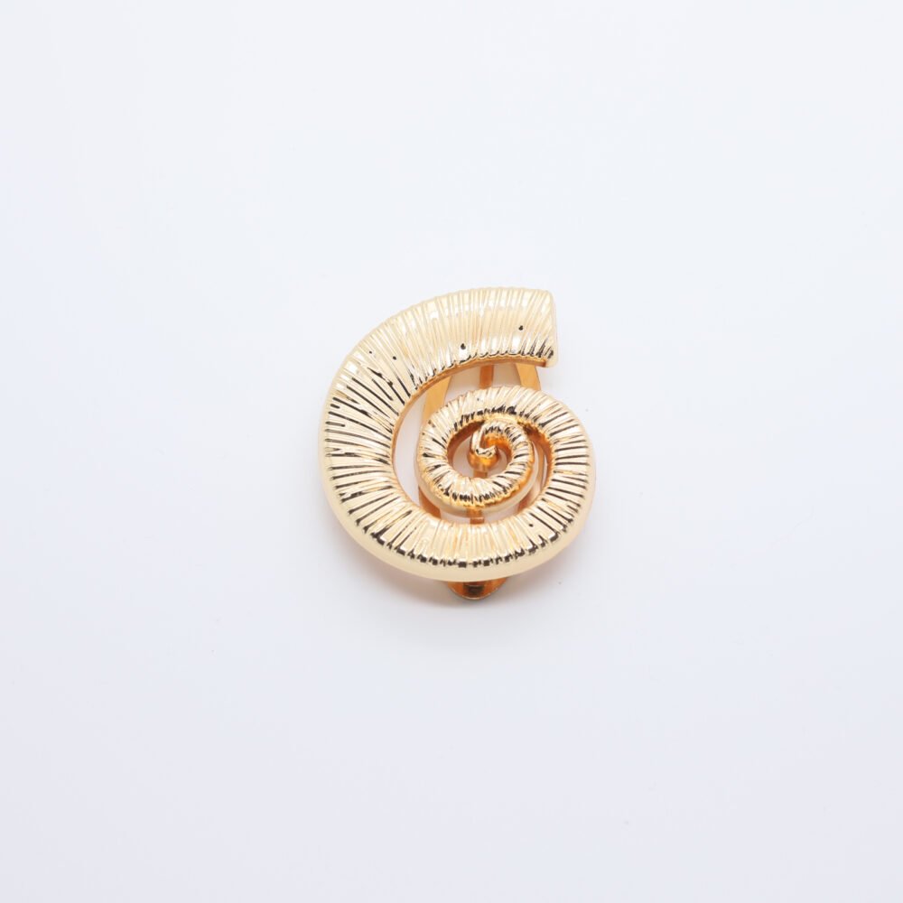 Passant en forme de coquille de conque