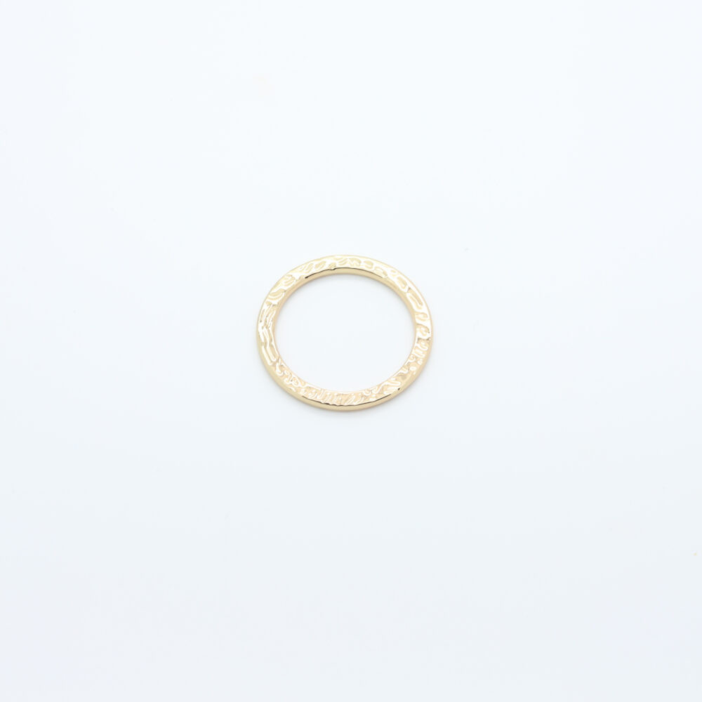 Textured connector buckle in gold-plated metal