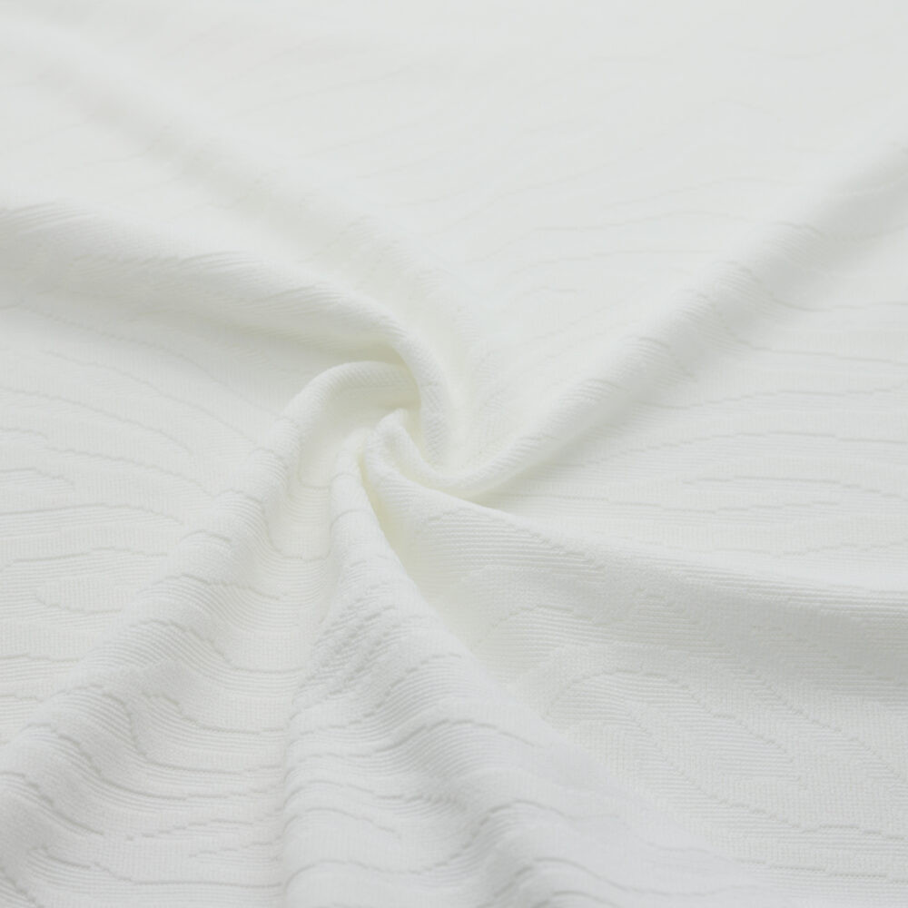 Tissu en jacquard extensible texturé blanc à motif zèbre, mercerie D'YRSAN