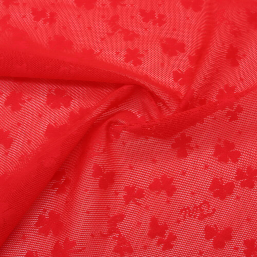 Tessuto jacquard rosso a rete con motivi Lucky in nylon elastan