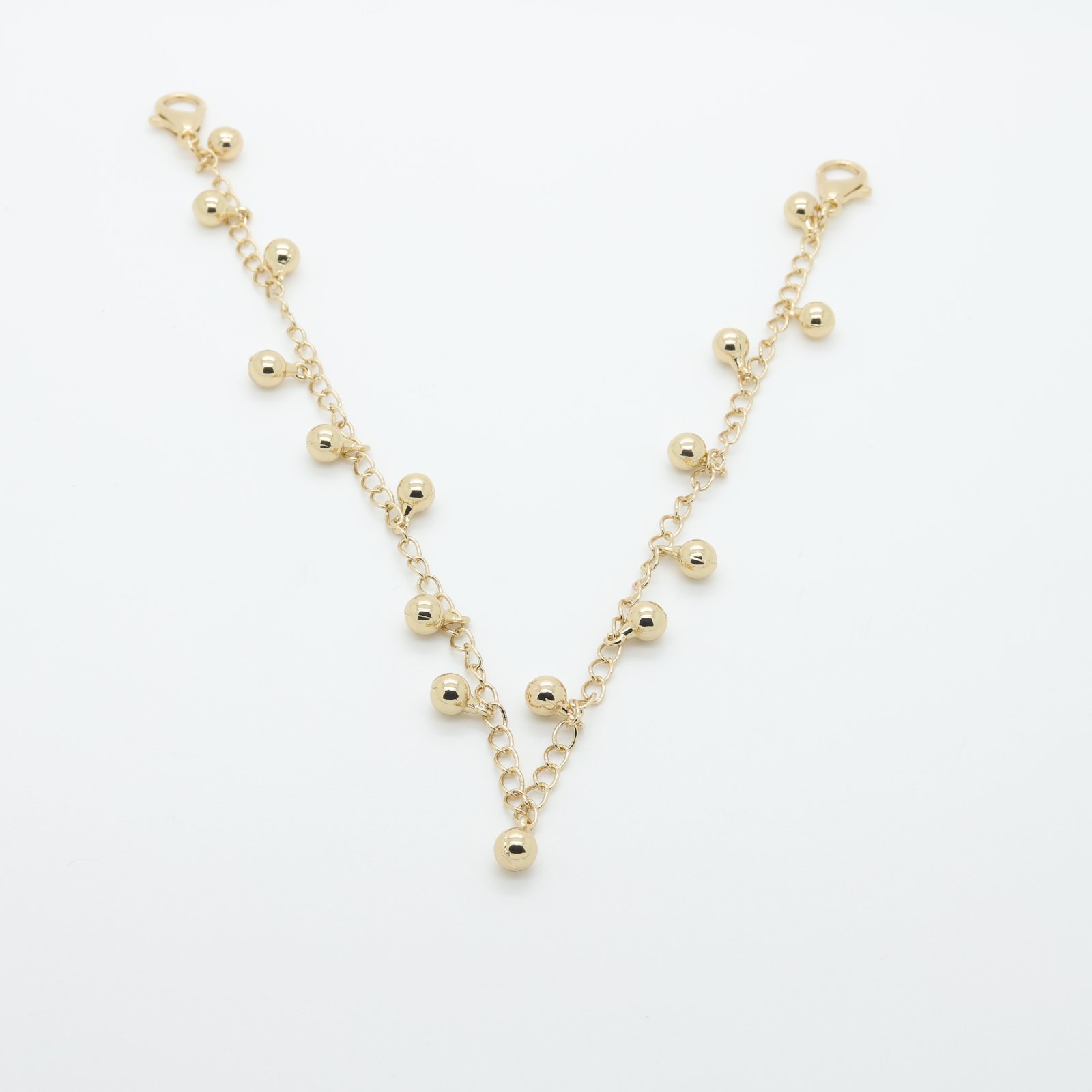 Cadena decorativa chapada en oro con colgantes