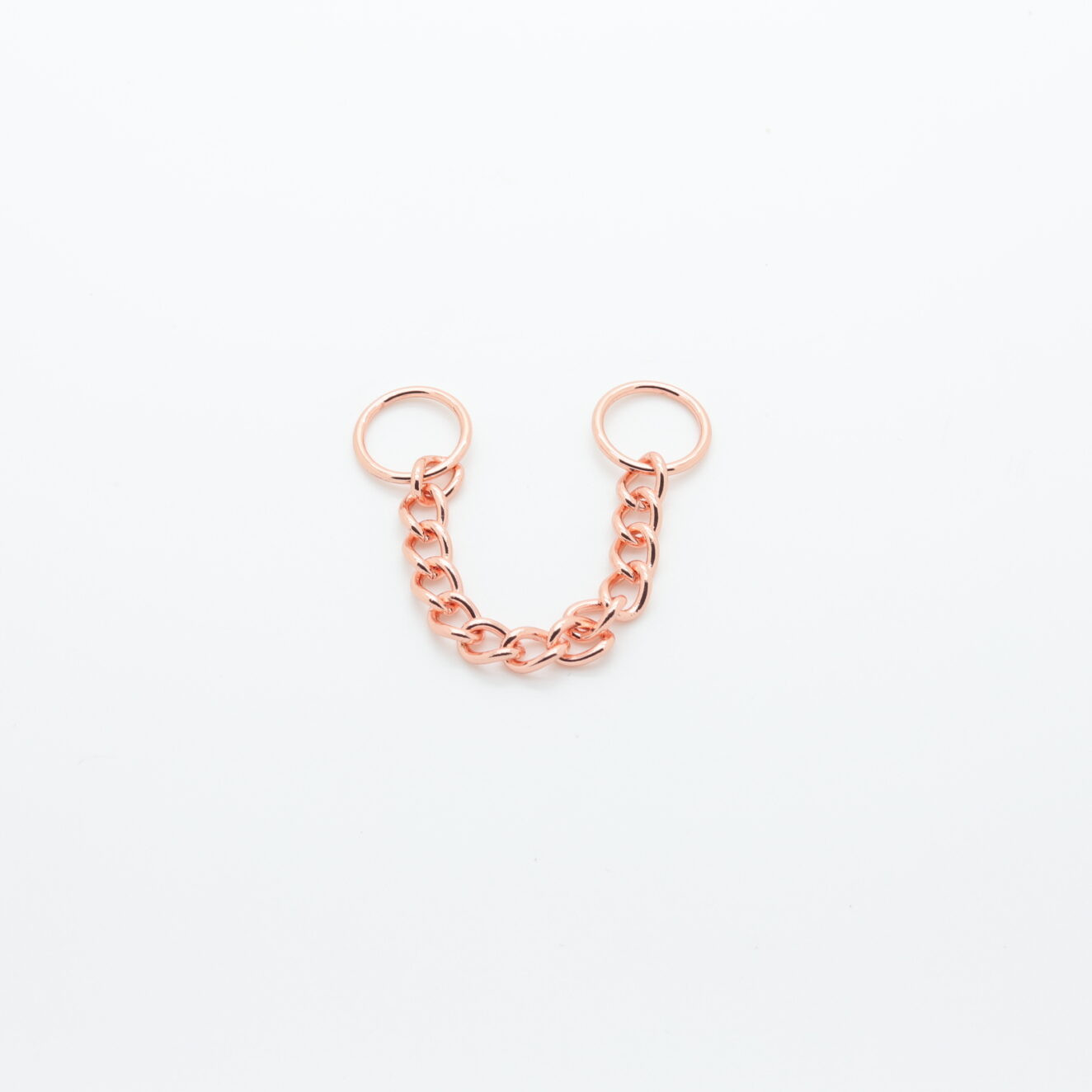 Decorative jewelry chain in pink gold metal with rings