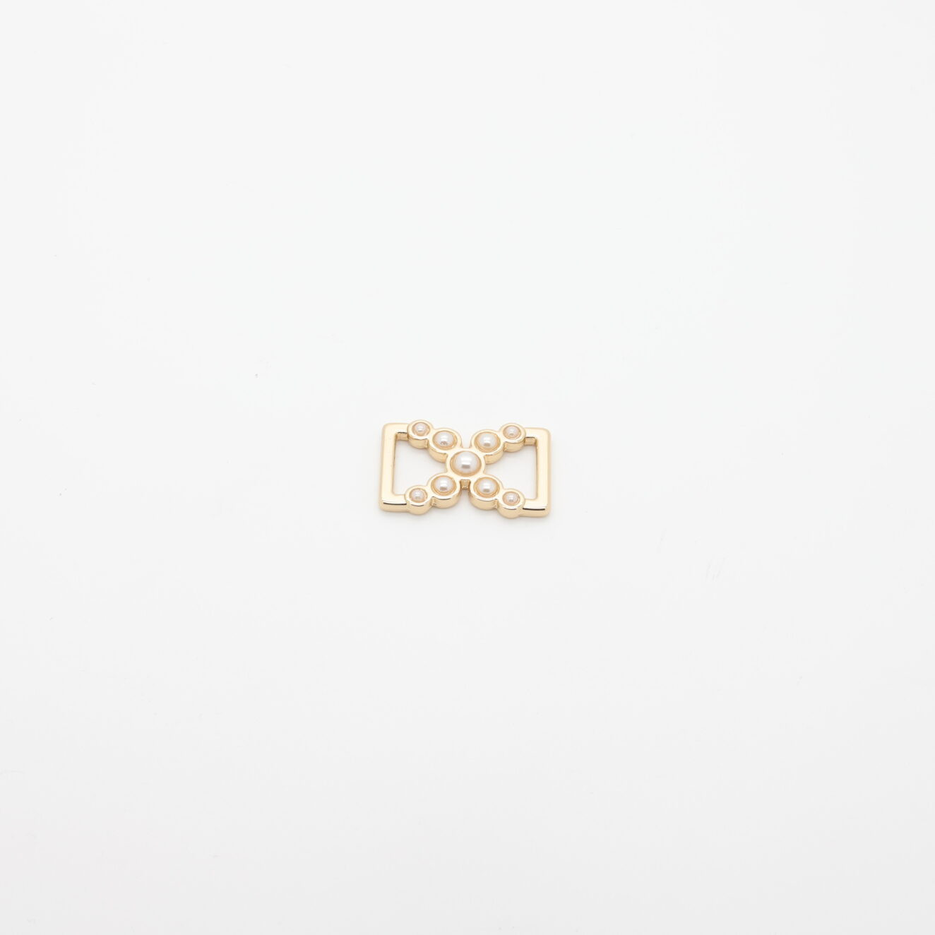Gold-plated metal connector adorned with pearls