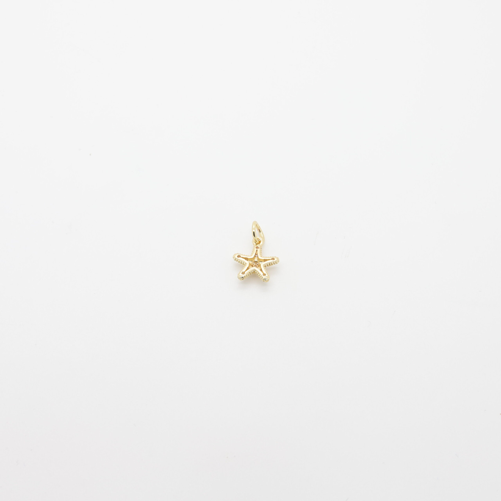 Pendentif en forme d’étoile de mer en métal doré