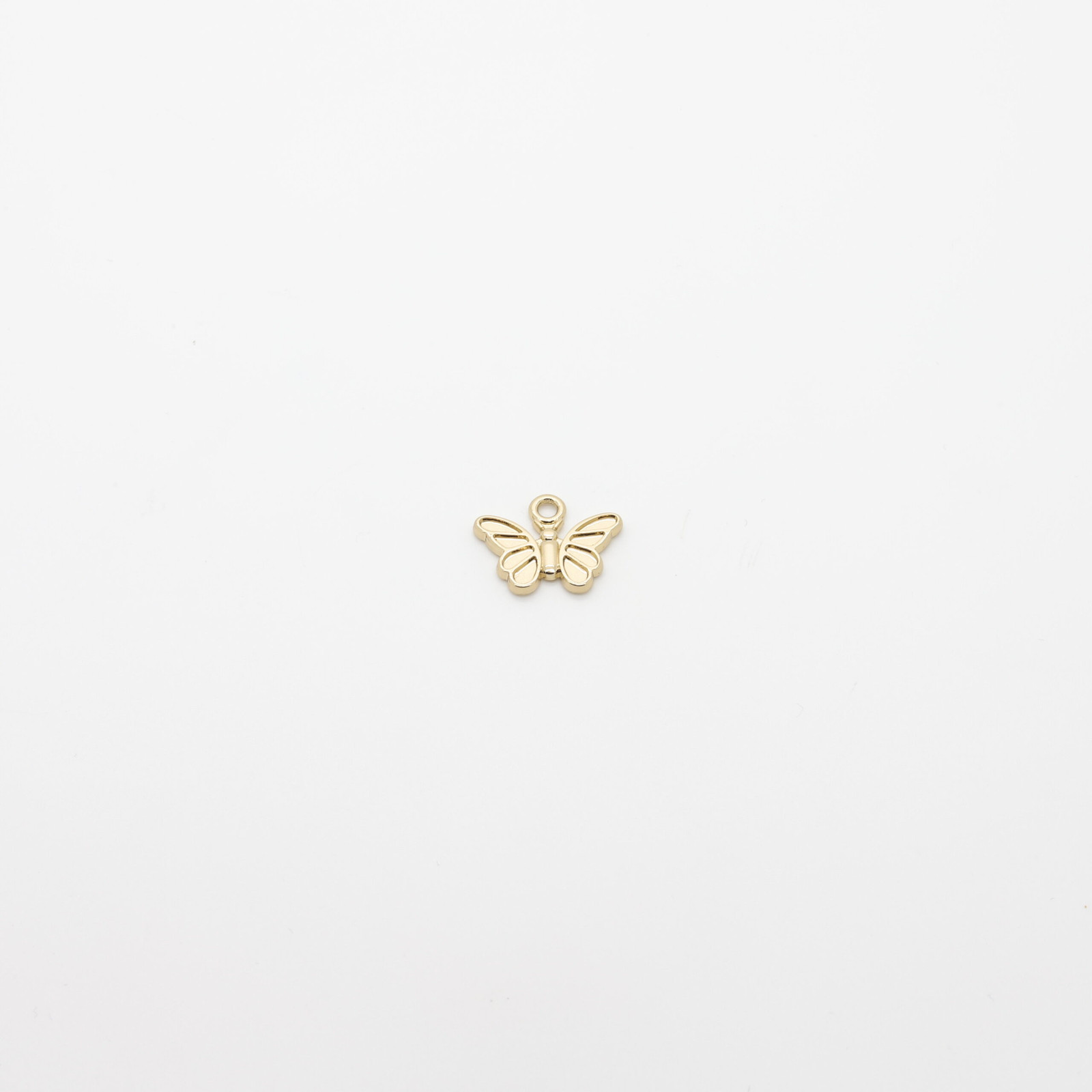 Pendentif papillon en métal doré