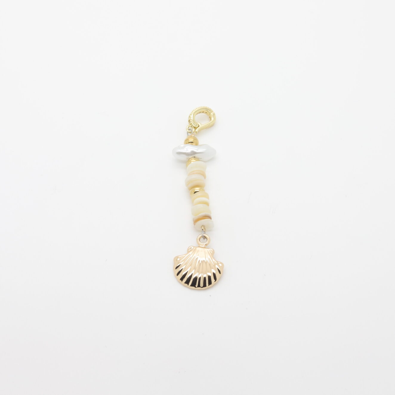 Gold bathing suit jewel with shell