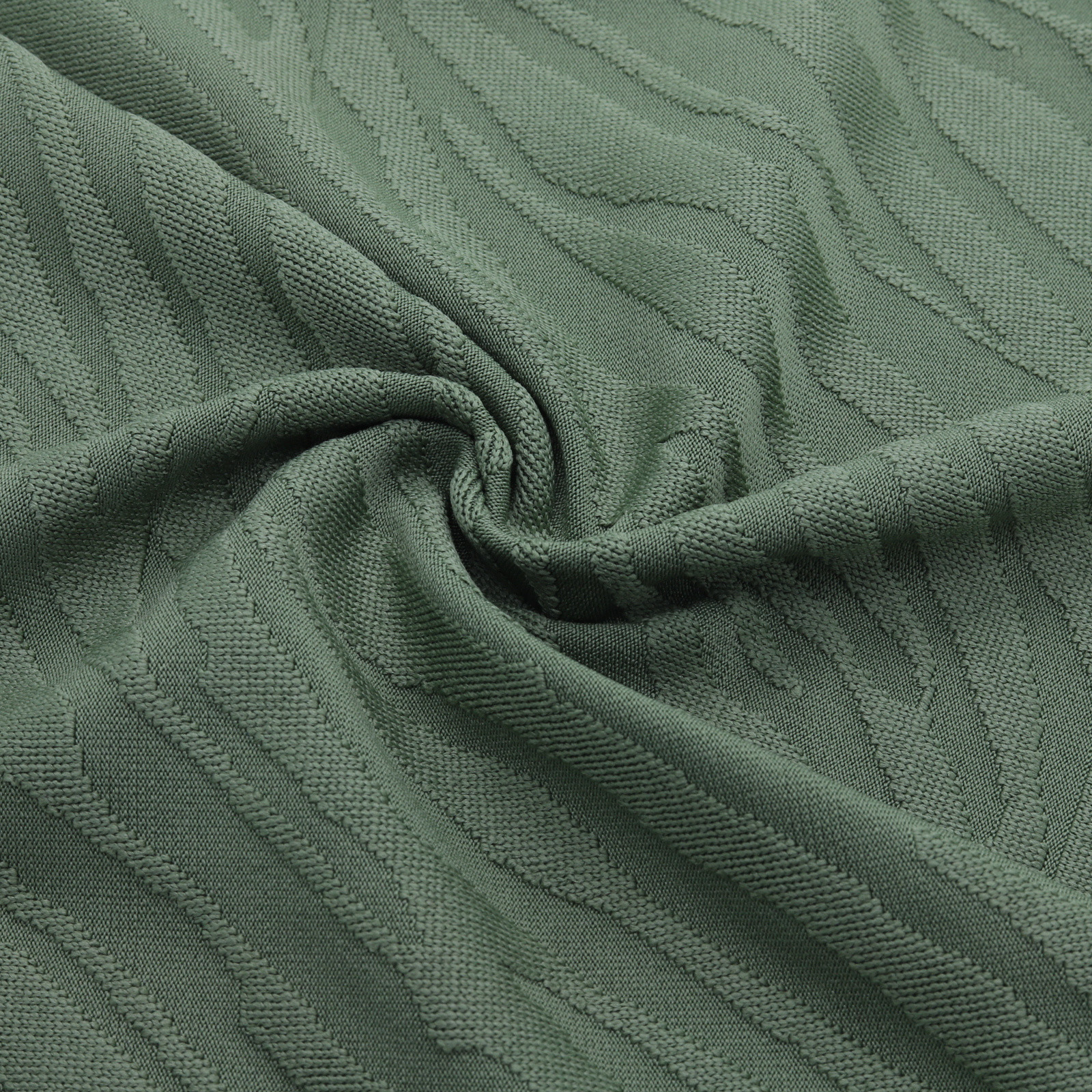 Tejido jacquard verde con estampado en relieve