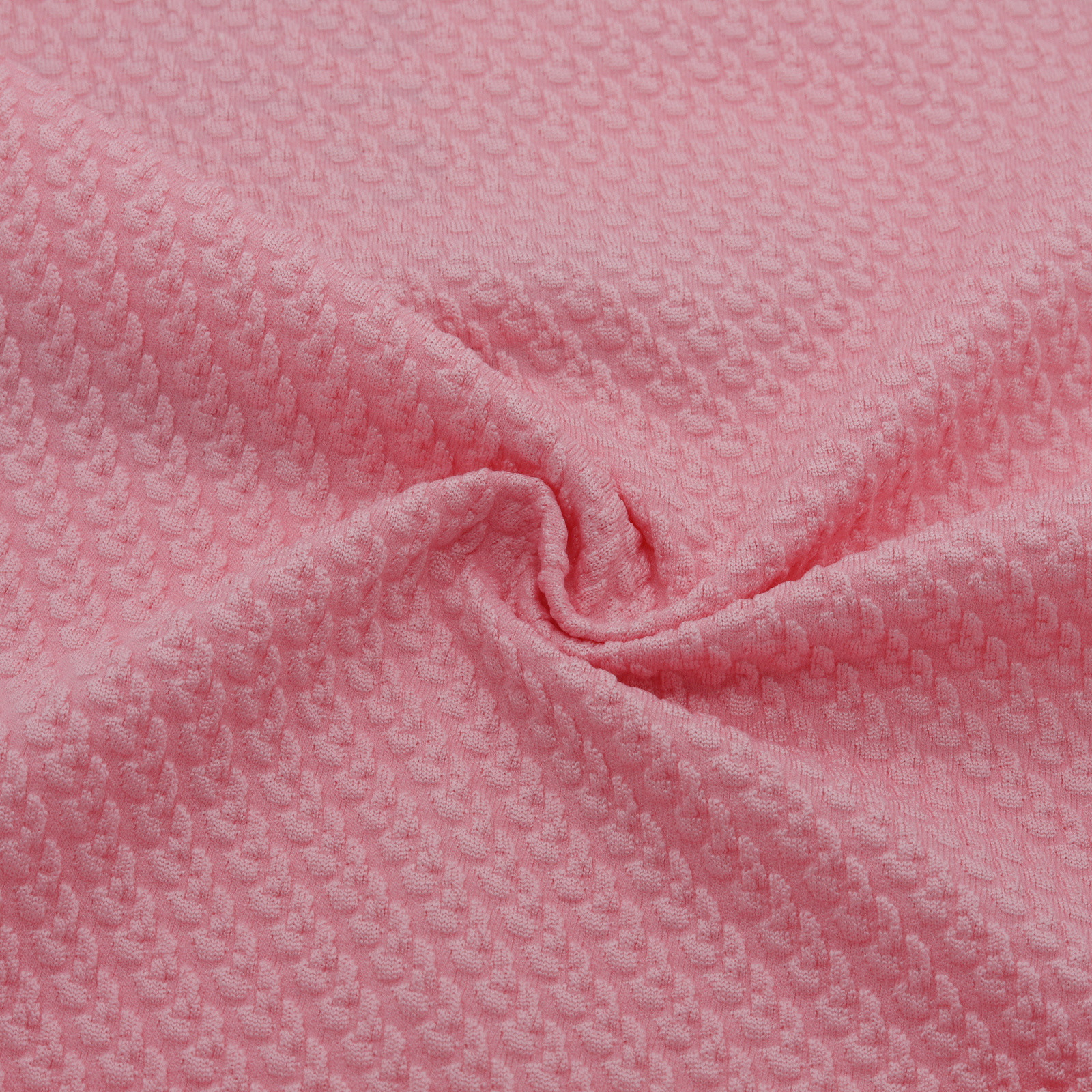 Tejido jacquard elástico texturizado rosa con relieve discreto y regular - Rollo 50M | D'YRSAN Tejido jacquard rosa con textura elástica y estampado discreto y regular