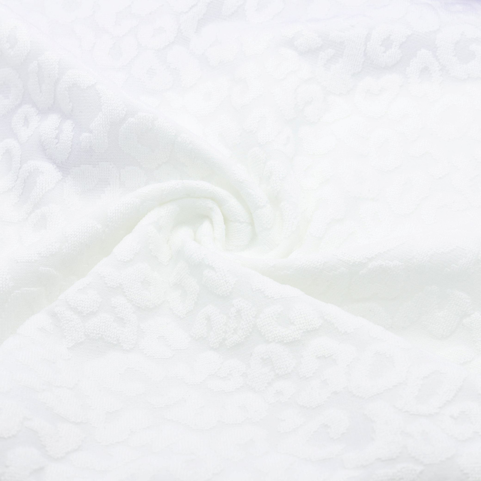 Tissu jacquard blanc extensible à motif léopard en relief | D'YRSAN | Tissu jacquard blanc extensible à motif léopard en relief | D'YRSAN