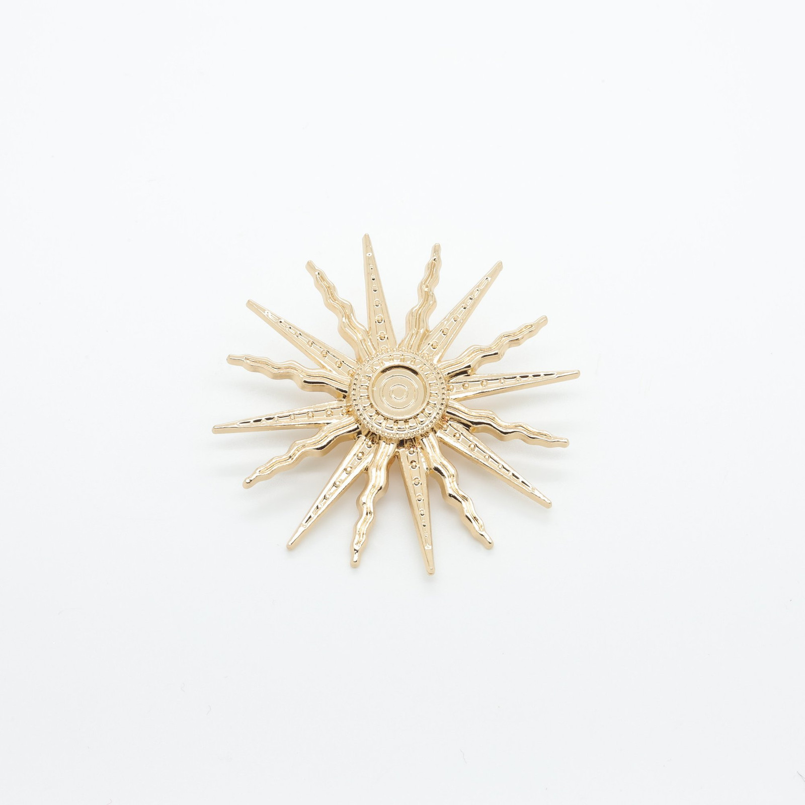 Broche soleil dorée à rayons